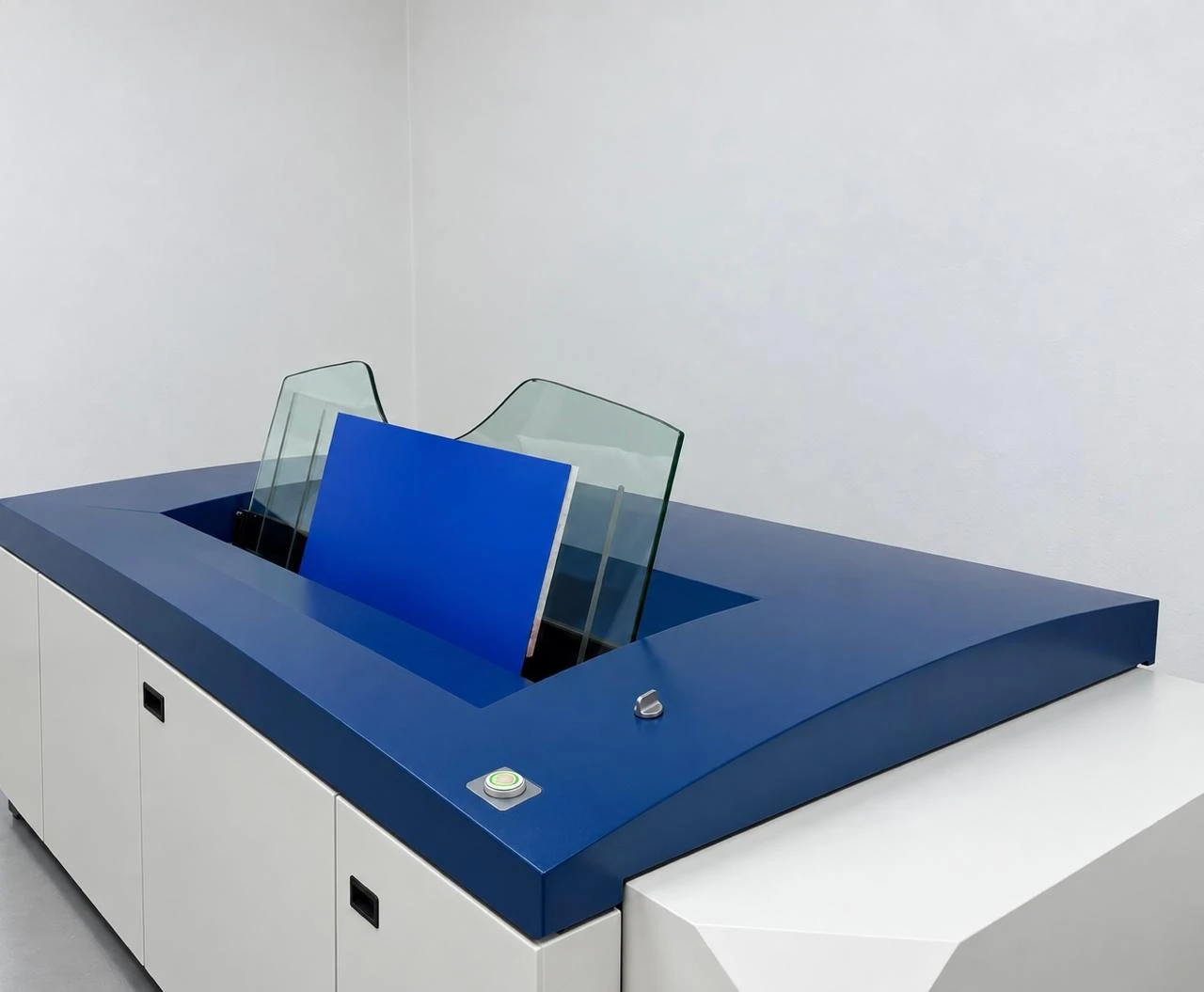 Blue printing plate loaded into CTP equipment.